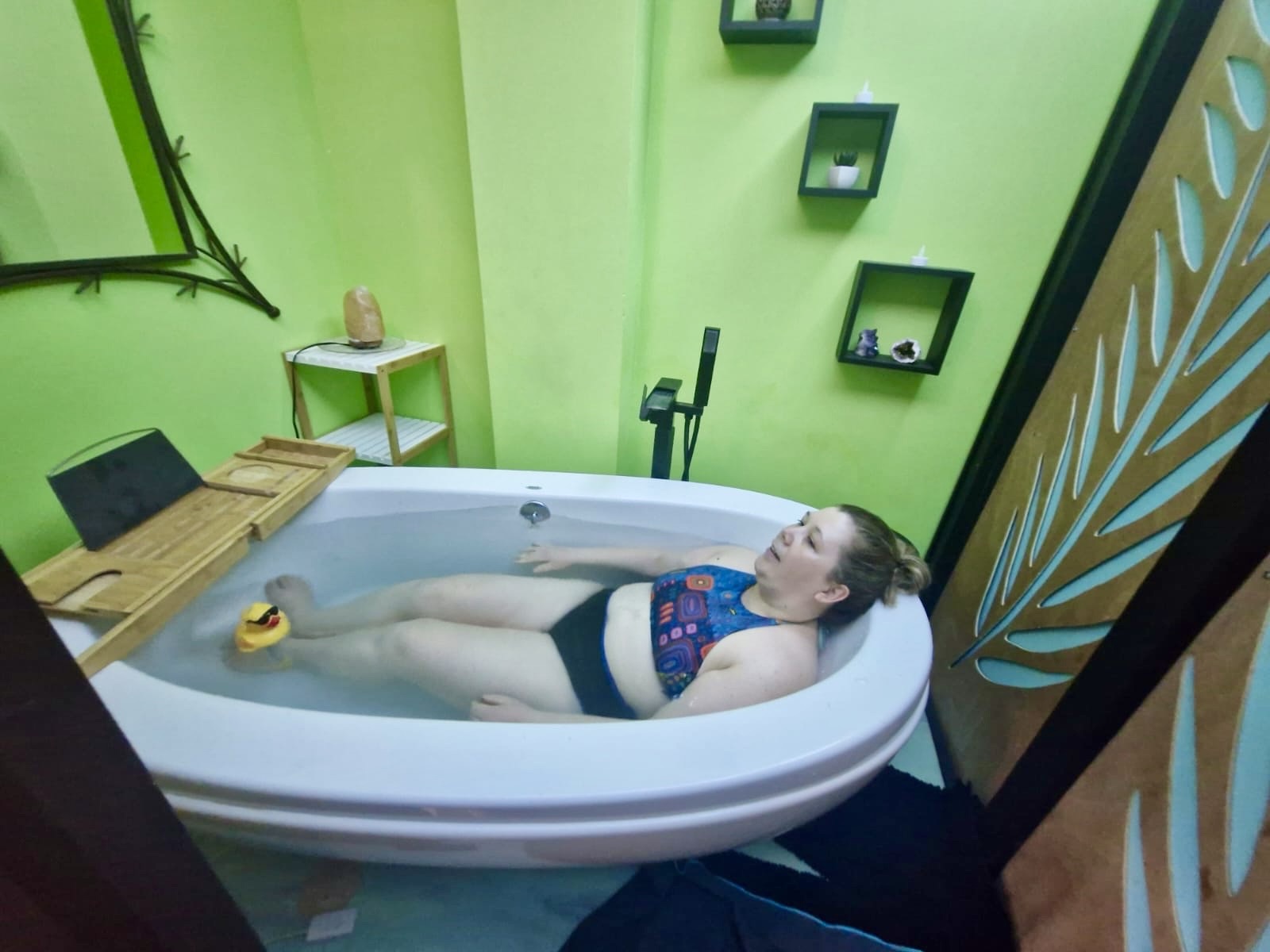 Woman laying in a bathtub